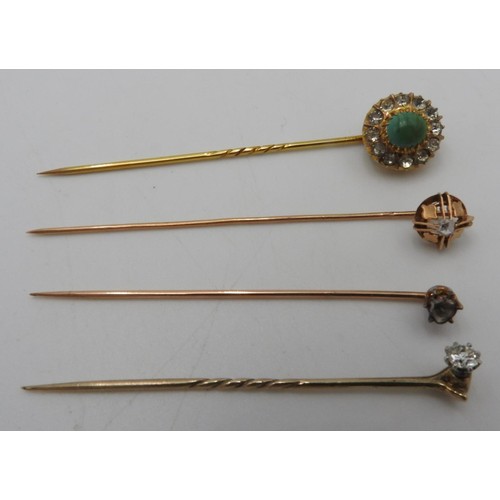 456 - A GOLD SOLITAIRE SET STICK PIN AND HARD STONE SET STICK PIN, with two other solitaire set stick pins