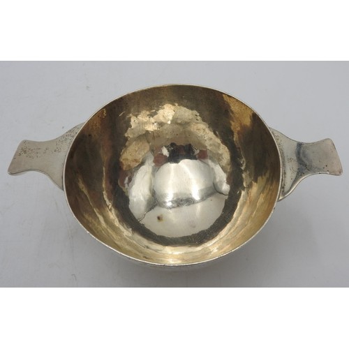 410 - A HALLMARK SILVER QUAICH, with a hammered finish, London 1932, 5.7 oz10.5 cm diameter15.5 cm overall... 