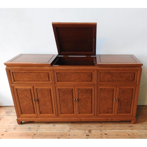 35 - AN ANGLO-CHINESE ROSEWOOD SIDEBOARD, with two lift-top sections, six panelled doors and cupboard spa... 