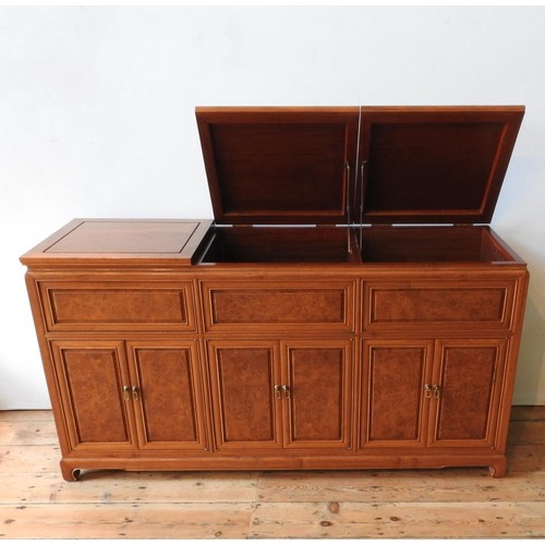 35 - AN ANGLO-CHINESE ROSEWOOD SIDEBOARD, with two lift-top sections, six panelled doors and cupboard spa... 