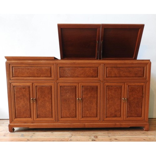 35 - AN ANGLO-CHINESE ROSEWOOD SIDEBOARD, with two lift-top sections, six panelled doors and cupboard spa... 