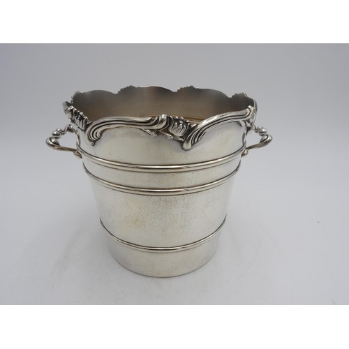 411 - A PERUVIAN SILVER ICE BUCKET BY CAMUSSO, tapered ribbed form with two scroll handles and lotus flowe... 