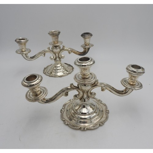 412 - A PAIR OF PERUVIAN SILVER CAMUSSO SILVER CANDELABRA, with two foliate style arms eminating from cent... 