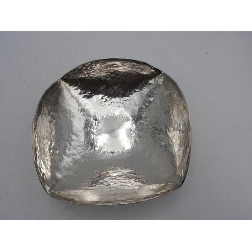 414 - A PERUVIAN HAMMERED SILVER BOWL, square shaped with curved edges, stamped 925, 7.5 oz