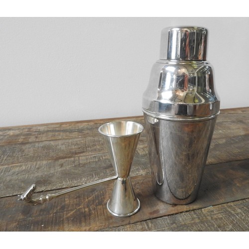 417 - A PERUVIAN SILVER JIGGER WITH HORSE HEAD DECORATION AND AN E.P.N.S SILVER PLATED COCKTAIL SHAKER, th... 