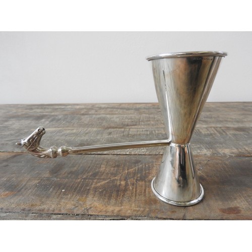 417 - A PERUVIAN SILVER JIGGER WITH HORSE HEAD DECORATION AND AN E.P.N.S SILVER PLATED COCKTAIL SHAKER, th... 