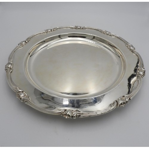 425 - TWO LARGE PERUVIAN SILVER SERVING DISHES BY CAMUSSO, the larger with lotus flower motif to the borde... 