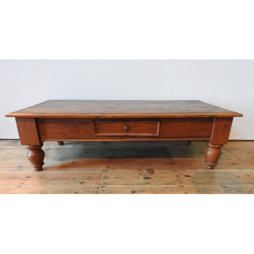 44 - A HARDWOOD COFFEE TABLE ON TURNED FEET WITH TWO DRAWERS, 34  121 x 60 cm