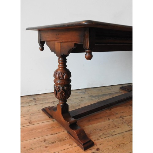 45 - AN OAK 20TH CENTURY JACOBEAN STYLE REFECTORY TABLE, with carved baluster supports, finial corners an... 