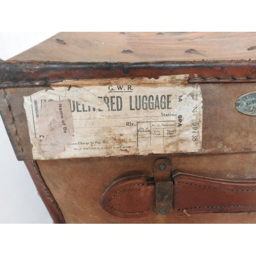 56 - A VINTAGE TIN TRUNK AND A VINTAGE CANVAS COVERED TRUNK