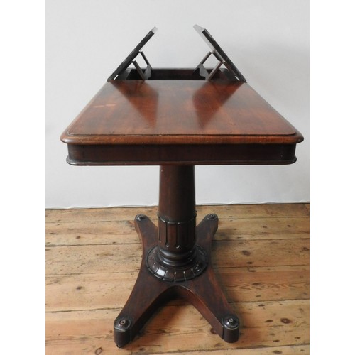 61 - A VICTORIAN MAHOGANY TABLE WITH TWO WRITING SLOPE SECTIONS, on a tulip carved pedestal with an X-sha... 