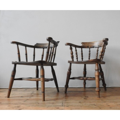 64 - TWO 19TH CENTURY SMOKER'S BOW CHAIRS, with twin stretcher bar supports, turned legs and turned pilla... 