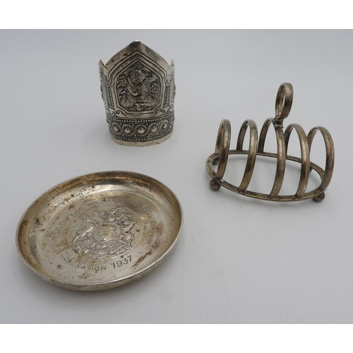 434 - A HALLMARK SILVER TOAST RACK AND PIN TRAY, AND AN ASIAN SILVER BANGLE, the bangle decorated with mer... 