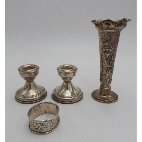 436 - A PAIR OF HALLMARK SILVER CANDLESTICKS, HALL MARK SILVER VASE AND NAPKIN RING, the silver trumpet va... 