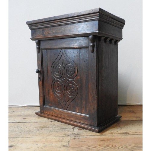 65 - AN EARLY 19TH CENTURY OAK JOINT STOOL AND A 19TH CENTURY OAK WALL CUPBOARD, with carved symmetrical ... 