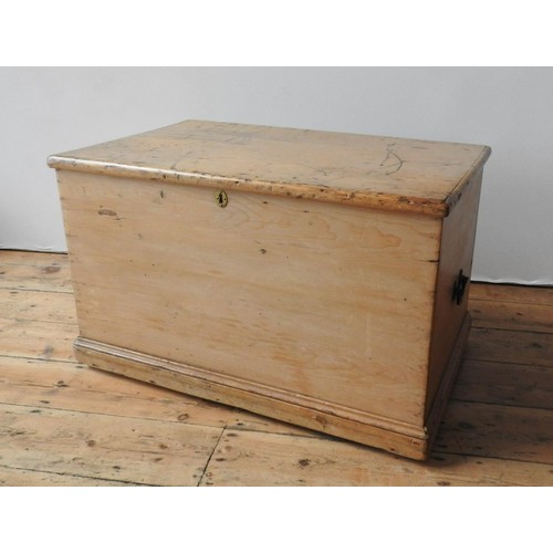 67 - A 19TH CENTURY WAXED PINE BLANKET BOX, with two iron ring handles, 52 x 83 x 52 cm