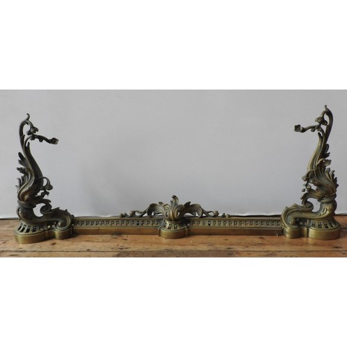 100 - A 19TH CENTURY ORNATE BRASS ADJUSTABLE FIRE CURB, with pierced rail and ornate acanthus decoration, ... 