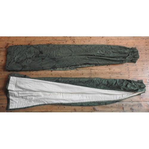 113 - A PAIR OF HEAVY WINTER LINED EMERALD GREEN DAMASK CURTAINS, each curtain measuring 250 cm wide x 280... 