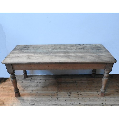 77 - A WAXED PINE RUSTIC FARMHOUSE TABLE, on turned legs 78 x 180 x 87 cm