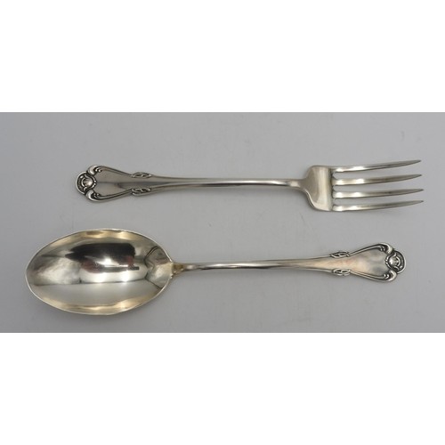 437 - A PERUVIAN SILVER SERVING SPOON AND FORK by Camusso, stamped Sterling 925, with lotus flower detaili... 