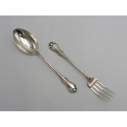 437 - A PERUVIAN SILVER SERVING SPOON AND FORK by Camusso, stamped Sterling 925, with lotus flower detaili... 