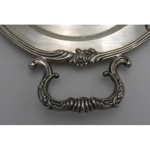 438 - A LARGE PERUVIAN SILVER OVAL TWO HANDLED TRAY BY CAMUSSO, with lotus flower detailing to the rim, sc... 