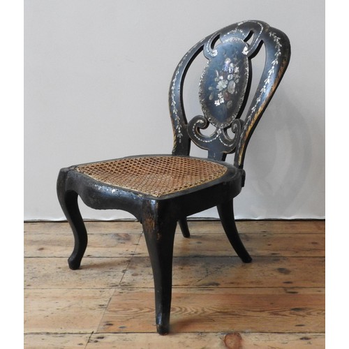 87 - A 19TH CENTURY PAPIER MACHE CANE SEATED CHILD'S CHAIR, with hand painted splat and mother of pearl i... 