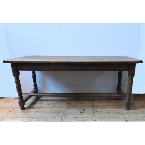 91 - A FRENCH 19TH CENTURY OAK FARMHOUSE TABLE ON TURNED LEGS, with stretcher bar support, 74 x 179 x 79 ... 