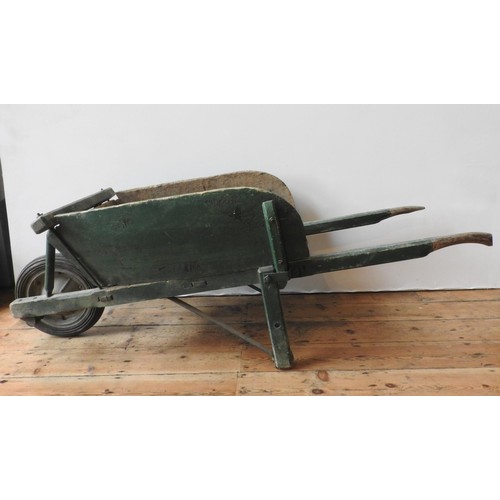 92 - A FRENCH RUSTIC GREEN PAINTED WHEELBARROW, the original wheel replaced with a later addition, 63 x 1... 