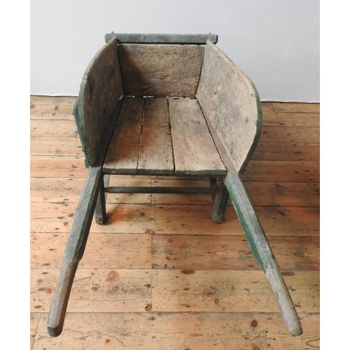 92 - A FRENCH RUSTIC GREEN PAINTED WHEELBARROW, the original wheel replaced with a later addition, 63 x 1... 