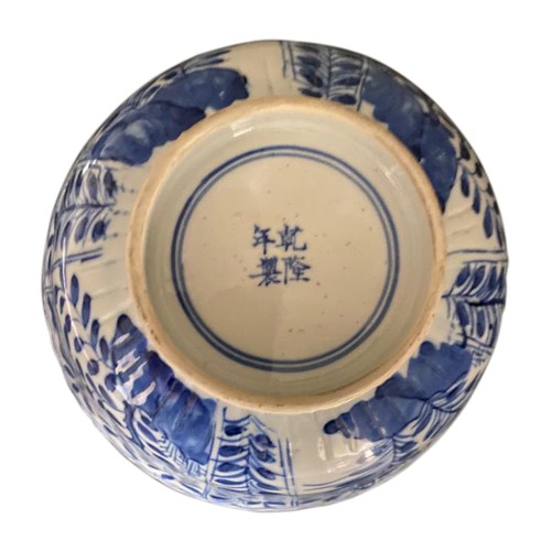 34A - BLUE AND WHITE BOWLKANGXI PERIOD (1662-1722)the side painted in underglaze blue with panels of flowe... 