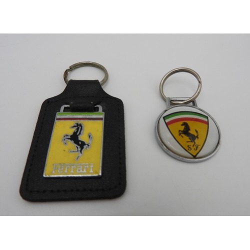 40 - ONE FERRARI KEYRING WITH LEATHER FOB AND ONE ROUND FERRARI KEYRINGThese are original dealer items fr... 