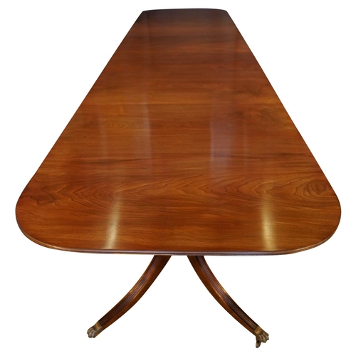 3 - MAHOGANY TRIPLE PILLAR DINING TABLE, BY JONATHAN SAINSBURYwith two leaf insertions, the d-shaped top... 