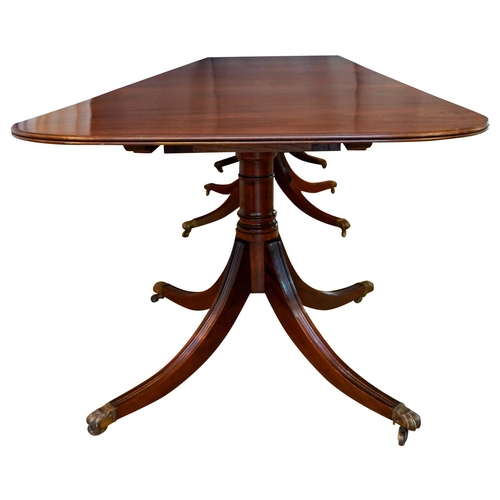 3 - MAHOGANY TRIPLE PILLAR DINING TABLE, BY JONATHAN SAINSBURYwith two leaf insertions, the d-shaped top... 