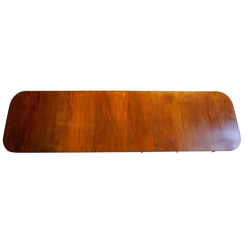 3 - MAHOGANY TRIPLE PILLAR DINING TABLE, BY JONATHAN SAINSBURYwith two leaf insertions, the d-shaped top... 