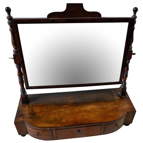 228 - REGENCY MAHOGANY TOILET MIRRORCIRCA 1820the rectangular adjustable mirror raised on twin turned upri... 