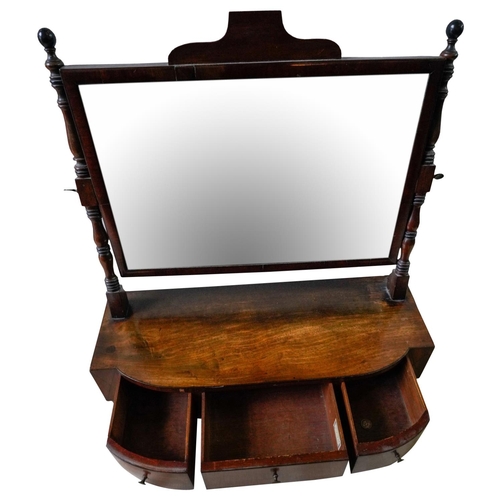 228 - REGENCY MAHOGANY TOILET MIRRORCIRCA 1820the rectangular adjustable mirror raised on twin turned upri... 