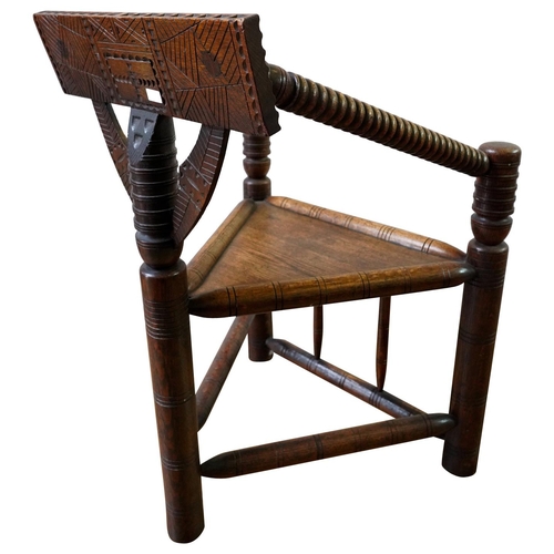 12 - OAK TURNERS CHAIR19TH CENTURYthe trepizochial back with bobbin turned arms, supported by a turned un... 