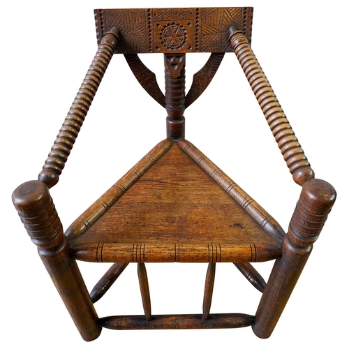 12 - OAK TURNERS CHAIR19TH CENTURYthe trepizochial back with bobbin turned arms, supported by a turned un... 