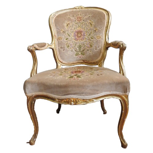 15 - LOUIS XV GILTWOOD FAUTEUIL18TH CENTURYthe shaped back, padded arms and serpentine shaped seat covere... 