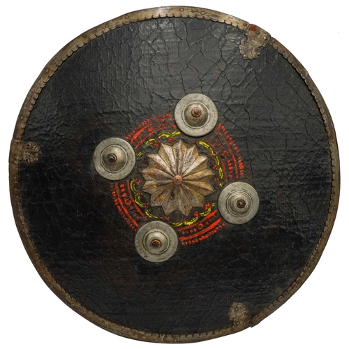 399 - SUDANESE ARAB SHIELDthe hide shield with four central metal bosses, with handle to the reverse, deco... 