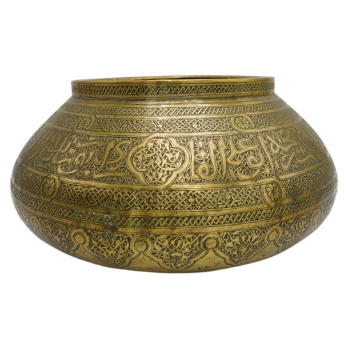 366 - ISLAMIC ENGRAVED BRASS BOWL19THN CENTURYthe compressed ovoid sides decorated with calligraphic and g... 