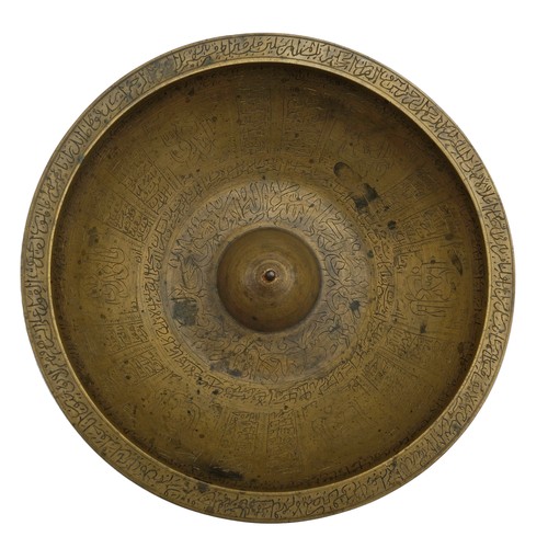 370 - ISLAMIC BRASS MAGIC BOWL19TH CENTURYthe bowl engraved throughout with bands of Koranic script21cm di... 