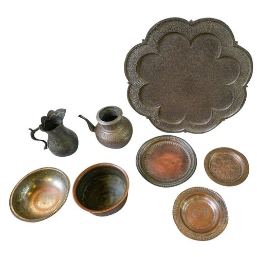 381 - GROUP OF PERSIAN TINNED COPPER WARES19TH CENTURYcomprising a large tray, three circular dishes, two ... 