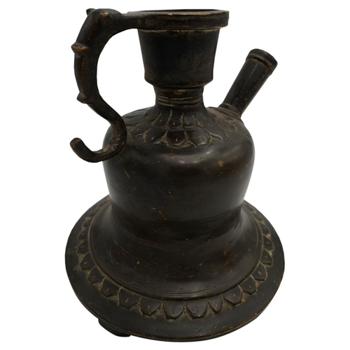 385 - BRONZE PERSIAN HOOKAH BASE18TH / 19TH CENTURYof typical form with a scroll handle and raised on thre... 