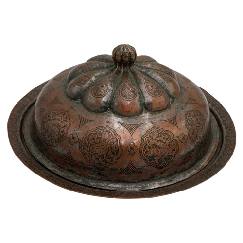 390 - PERSIAN TINNED COPPER COVERED DISH19TH CENTURY the domed cover engraved with a band of arabesques en... 