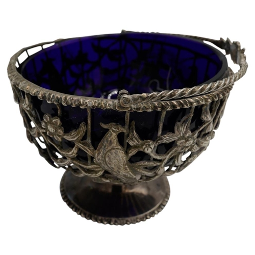 463 - GEORGE III SILVER SUGAR BASKETLONDON 1769the openwork sides with a blue glass liner and with applied... 