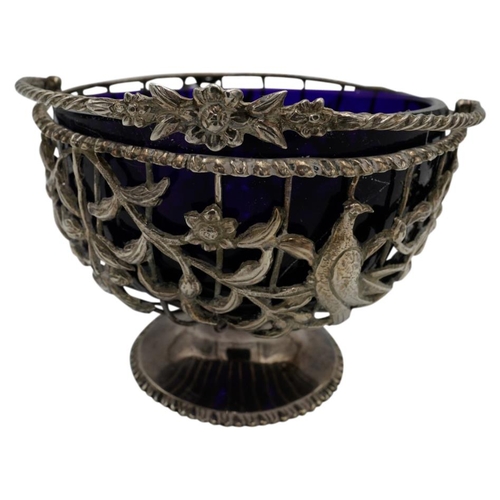 463 - GEORGE III SILVER SUGAR BASKETLONDON 1769the openwork sides with a blue glass liner and with applied... 