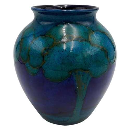 215 - WILLIAM MOORCROFT 'MOONLIT BLUE ' BALUSTER VASECIRCA1925painted with trees in a landscape, signed in... 