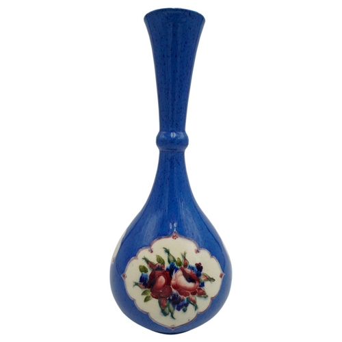 216 - WILLIAM MOORCROFT POWDER-BLUE BOTTLE VASECIRCA 1920the body decorated with floral filled panels, res... 